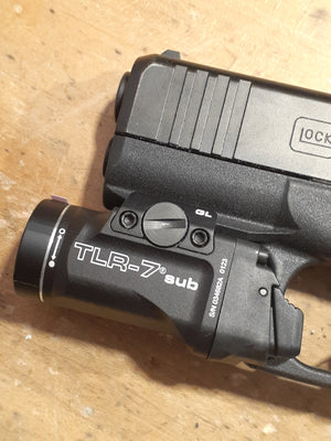 Glock with tlr7 sub tactical light mounted